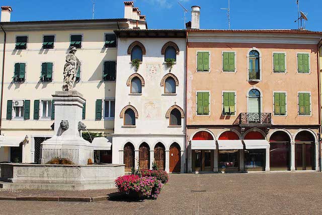 11042322 - piazza paolo diacono in the town of cividale del friuli, italy. the statue atop the fountain features four lion heads and diana the hunter, and was donated to the city by earl de claricini of bottenicco